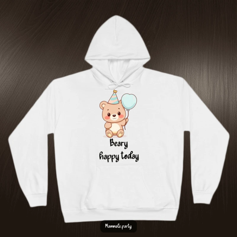Funny hoodie showing a cute bear cub wearing a party hat and holding a balloon, embodying cozy celebration and festive cheer.