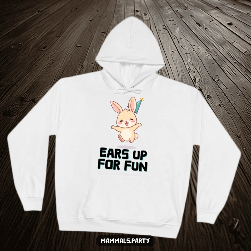 Funny hoodie showing an excited bunny bouncing with ears flopped back, wearing a party hat, perfect for festive moments.