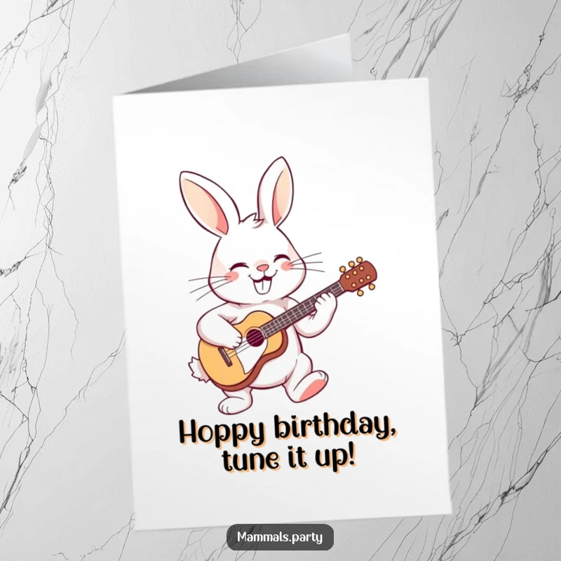 Funny Free Printable Birthday Card: Cheerful rabbit strumming a tiny guitar with a wide, happy grin.