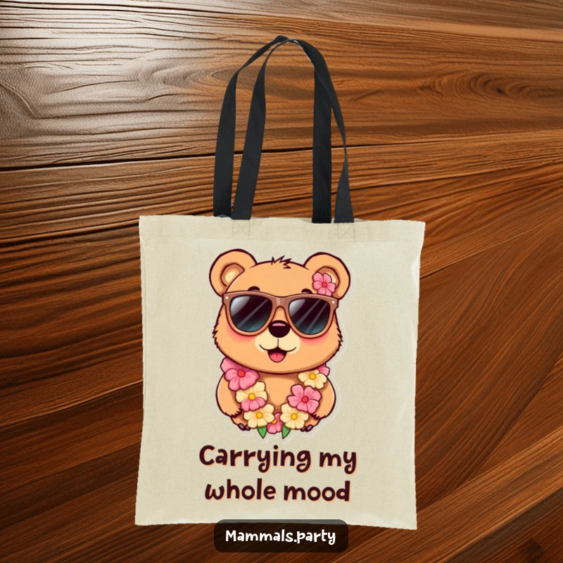 Funny tote bag featuring a curious bear character with oversized sunglasses and a lei, perfect for carrying items with a touch of humor.