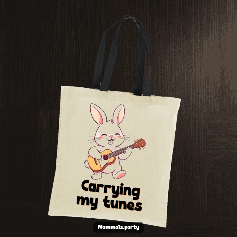 Funny tote bag with a grinning rabbit playing a tiny guitar, perfect for carrying music essentials or everyday items with a musical theme.