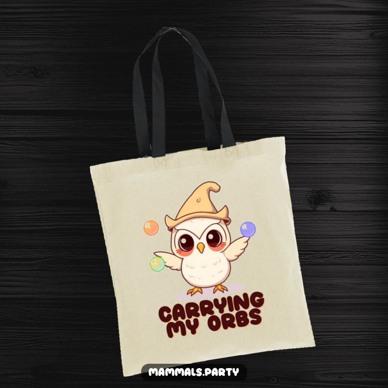 Funny owl in a silly hat juggling glowing orbs on a tote bag, perfect for carrying books or treasures with a touch of magic.